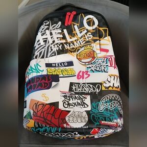 SPRAYGROUND HELLO WORLD TAGGED UP BACKPACK LE